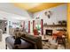 Comfortable living room with a fireplace, stylish decor, seamless view to the dining area and natural light at 6222 N 21St Dr, Phoenix, AZ 85015