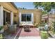 Charming patio area with comfortable seating, a cozy fire pit, and lush greenery at 6222 N 21St Dr, Phoenix, AZ 85015