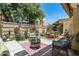 Outdoor patio area showcasing a fire pit, seating, and surrounding landscape at 6222 N 21St Dr, Phoenix, AZ 85015