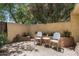 Cozy backyard patio featuring a seating area, charming decor, and shaded ambiance at 6222 N 21St Dr, Phoenix, AZ 85015