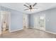 Spacious bedroom with wood floors, an ensuite bathroom, and french doors at 6565 N 19Th Ave # 45, Phoenix, AZ 85015