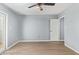 Spacious bedroom features light colored floors, ceiling fan, and dual doors at 6565 N 19Th Ave # 45, Phoenix, AZ 85015