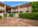 Charming townhouse complex with well-maintained landscaping and gated patios at 6565 N 19Th Ave # 45, Phoenix, AZ 85015