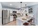 Contemporary kitchen with stainless steel appliances and breakfast bar with seating at 6565 N 19Th Ave # 45, Phoenix, AZ 85015