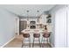 Beautiful kitchen with stainless steel appliances, breakfast bar, and modern pendant lighting at 6565 N 19Th Ave # 45, Phoenix, AZ 85015