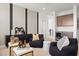 Relaxing living room featuring beanbag chairs, a wet bar, and modern decor, creating a versatile and inviting space at 7401 W Buckhorn Trl, Peoria, AZ 85383