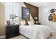 Nicely decorated bedroom with contemporary colors, window shutters, and masculine themed decor at 7404 W Buckhorn Trl, Peoria, AZ 85383