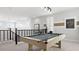 Game room featuring a billiard table with modern lighting and stylish decor for entertaining at 7404 W Buckhorn Trl, Peoria, AZ 85383