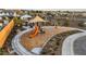 Community playground featuring a slide, swing set, and shaded picnic area at 7404 W Buckhorn Trl, Peoria, AZ 85383