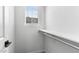 Bright closet features a built-in shelf, chrome hanging bar, and window with natural light at 7430 S 75Th Dr, Laveen, AZ 85339