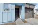 Close-up view of the townhome's front door, showing the address and the attached garage at 7430 S 75Th Dr, Laveen, AZ 85339