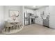 Stylish kitchen featuring stainless steel appliances, a dining area, and neutral décor at 7430 S 75Th Dr, Laveen, AZ 85339