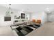 Well-decorated living room with modern furniture, neutral colors, and ample natural light at 7430 S 75Th Dr, Laveen, AZ 85339