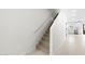 An interior shot of the staircase leading to the upper level of the townhome at 7430 S 75Th Dr, Laveen, AZ 85339