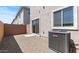 Low-maintenance backyard with gravel landscaping, block walls and a sliding glass door at 7437 S 75Th Dr, Laveen, AZ 85339