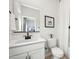 Clean bathroom with a white vanity, modern fixtures, and a well-lit mirror at 7437 S 75Th Dr, Laveen, AZ 85339