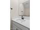 Modern bathroom featuring a white vanity with matte black fixtures and a large mirror at 7437 S 75Th Dr, Laveen, AZ 85339