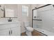 Modern bathroom featuring a walk-in shower with black hardware and a white vanity at 7437 S 75Th Dr, Laveen, AZ 85339