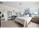 Cozy bedroom featuring a comfortable bed, stylish decor, and a functional workspace at 7437 S 75Th Dr, Laveen, AZ 85339