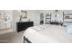 Relaxing bedroom with a dresser, stylish ladder shelf, and en-suite bathroom access at 7437 S 75Th Dr, Laveen, AZ 85339