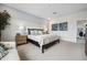 Serene bedroom with soft lighting, a plush bed, and elegant décor, creating a peaceful retreat at 7437 S 75Th Dr, Laveen, AZ 85339