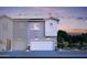 Stylish two-story home featuring a two-car garage, light gray and white siding, and modern design at 7437 S 75Th Dr, Laveen, AZ 85339