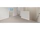 Hallway with neutral carpet, white walls, and staircase for comfortable access to upper level at 7437 S 75Th Dr, Laveen, AZ 85339