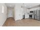 Kitchen area with white cabinets, stainless steel appliances, and light wood flooring at 7437 S 75Th Dr, Laveen, AZ 85339