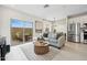 Comfortable living area with sliding door access to the backyard and seamless access to the kitchen at 7437 S 75Th Dr, Laveen, AZ 85339