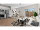Bright living room featuring modern decor, wood floors, and a sliding glass door at 7437 S 75Th Dr, Laveen, AZ 85339