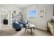 Cozy sitting room with stylish blue chairs, natural light, and serene views of the outside at 7437 S 75Th Dr, Laveen, AZ 85339