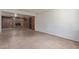 Large basement space showcasing wood paneling, tile floors, and a cozy brick fireplace feature at 8033 N 56Th Ave, Glendale, AZ 85302