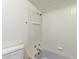 Bathroom shower and toilet featuring white tile at 8033 N 56Th Ave, Glendale, AZ 85302