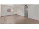 This home features an empty living room, a neutral color palette, and durable tile flooring at 8033 N 56Th Ave, Glendale, AZ 85302