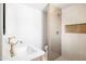 Modern bathroom featuring walk-in shower, sleek fixtures, and neutral-toned tile at 8334 E Palm Ln, Scottsdale, AZ 85257