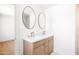Modern bathroom featuring dual sinks, white countertops, and contemporary fixtures at 8334 E Palm Ln, Scottsdale, AZ 85257