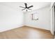 Bright bedroom featuring a ceiling fan, light-colored wood floors, and a window at 8334 E Palm Ln, Scottsdale, AZ 85257