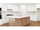 Stylish kitchen with white cabinets, an island, and stainless steel appliances at 8334 E Palm Ln, Scottsdale, AZ 85257