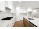 Modern kitchen showcasing white cabinets, stainless steel appliances, and a center island at 8334 E Palm Ln, Scottsdale, AZ 85257