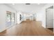 Open living space with wood-look floors, white cabinets, and a sliding glass door to outdoor patio at 8334 E Palm Ln, Scottsdale, AZ 85257