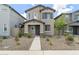 Charming two-story home with a well-maintained yard, neutral colored stucco, and a welcoming walkway to the front door at 8343 E Irwin Ave, Mesa, AZ 85209