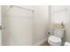 Toilet with white walls and a basket on the tank in a clean, well-lit bathroom at 8343 E Irwin Ave, Mesa, AZ 85209