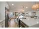 Open-concept kitchen with a large island, stainless steel appliances, and views of the living area at 8425 E Bonnie Rose Ave, Scottsdale, AZ 85250