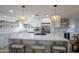 Modern kitchen with a large island, pendant lights, stainless steel appliances, and ample counter space at 8425 E Bonnie Rose Ave, Scottsdale, AZ 85250