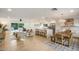 Open-concept living space with a modern kitchen, dining area, and comfortable living room at 8425 E Bonnie Rose Ave, Scottsdale, AZ 85250