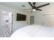 Relaxing main bedroom offering a ceiling fan and an ensuite bathroom at 8425 E Bonnie Rose Ave, Scottsdale, AZ 85250