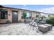 Cozy outdoor patio with modern seating, a stylish rug, and a paved stone floor at 8425 E Bonnie Rose Ave, Scottsdale, AZ 85250