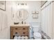 Charming bathroom with modern fixtures, a rustic vanity, and a subway tile backsplash at 8455 E Orange Blossom Ln, Scottsdale, AZ 85250