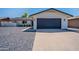 Charming single-Gathering home featuring a modern design, two-car garage, and low-maintenance landscaping at 8455 E Orange Blossom Ln, Scottsdale, AZ 85250
