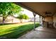 Enjoy outdoor living on this spacious covered patio, overlooking the lush backyard at 919 W Lodge Dr, Tempe, AZ 85283